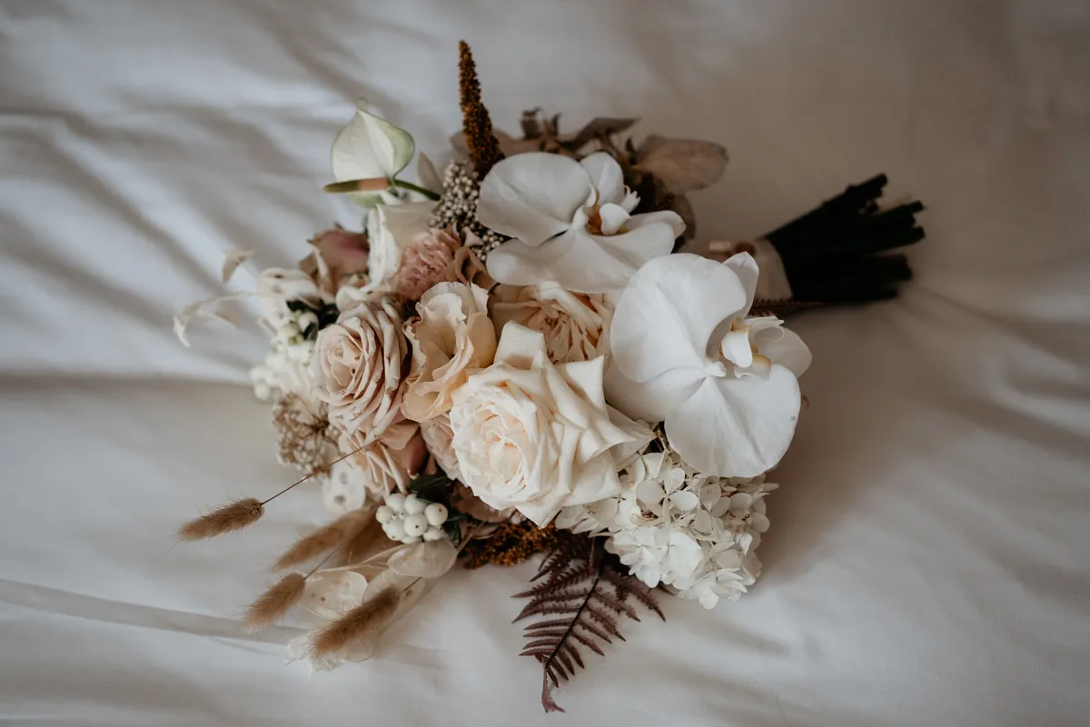 A bridal bouquet of native australian flowers and a beautiful bride